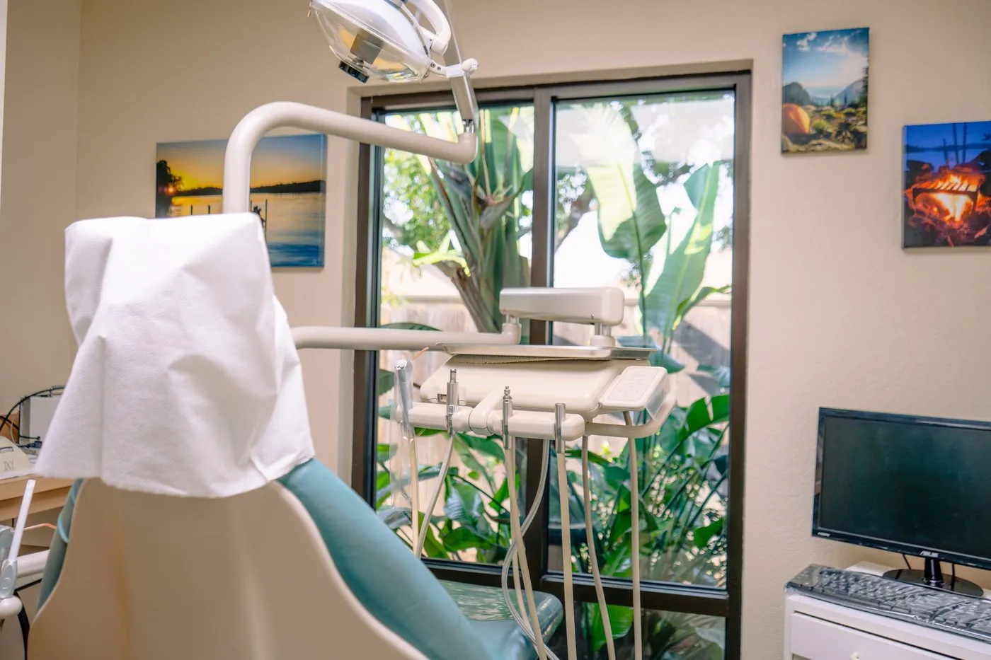 Bright dental treatment room in Tulare with garden view